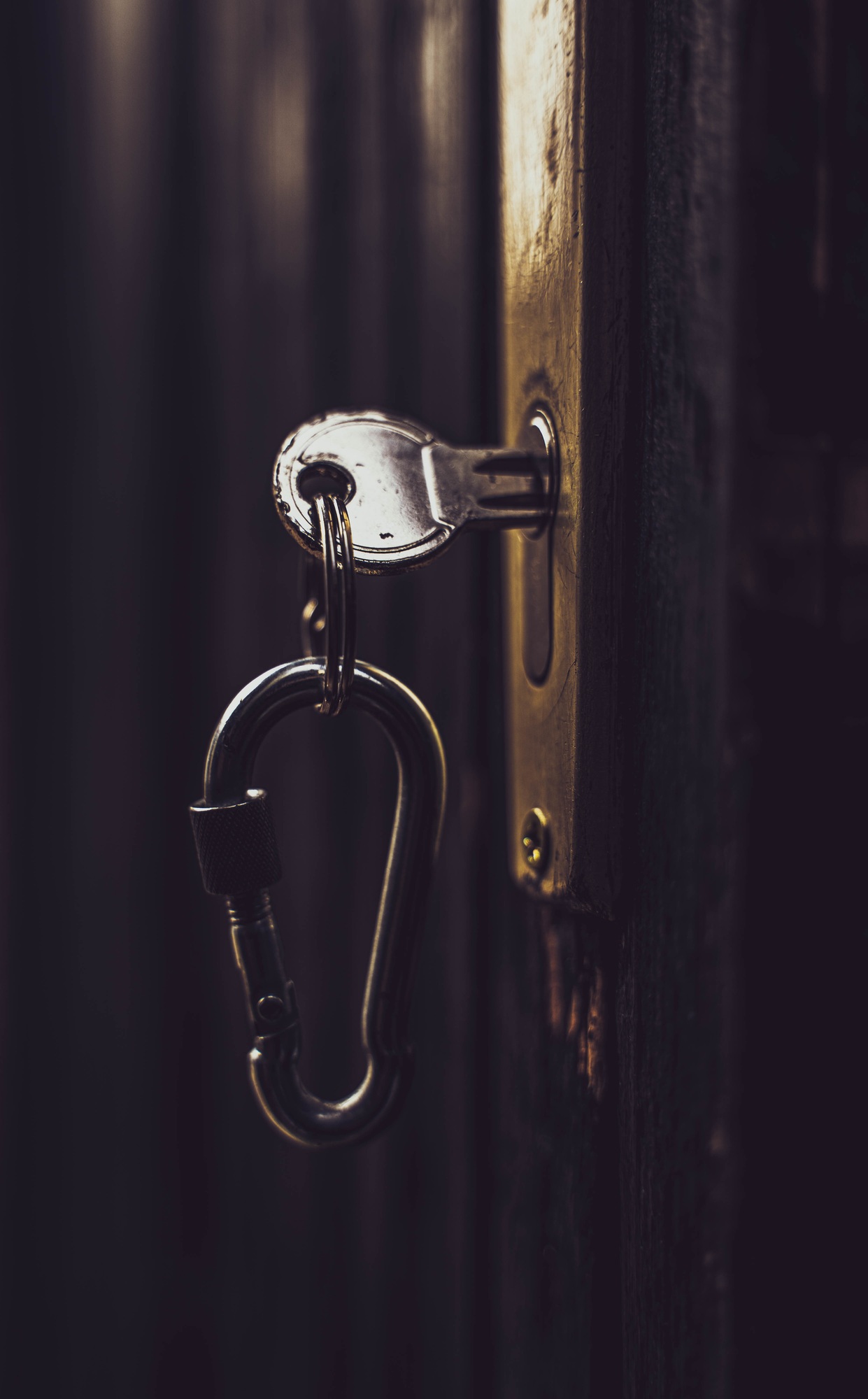 Vertical shot of keys stuck in a lock